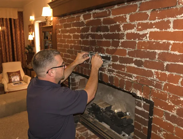 South Whittier Chimney Sweep expert fixing a fireplace in South Whittier, CA